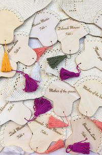 Mexican hand fan with colorful cotton tassels