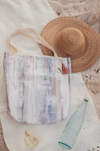 A canvas carry-all tote with a watercolor print